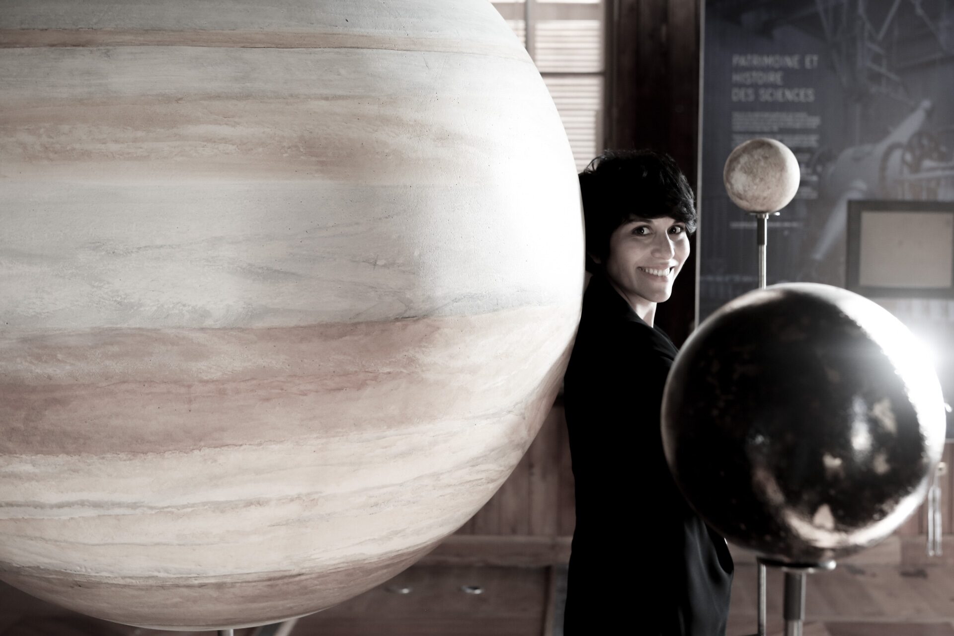 Yamila Miguel beside a model of Jupiter at the Old Observatory in Leiden