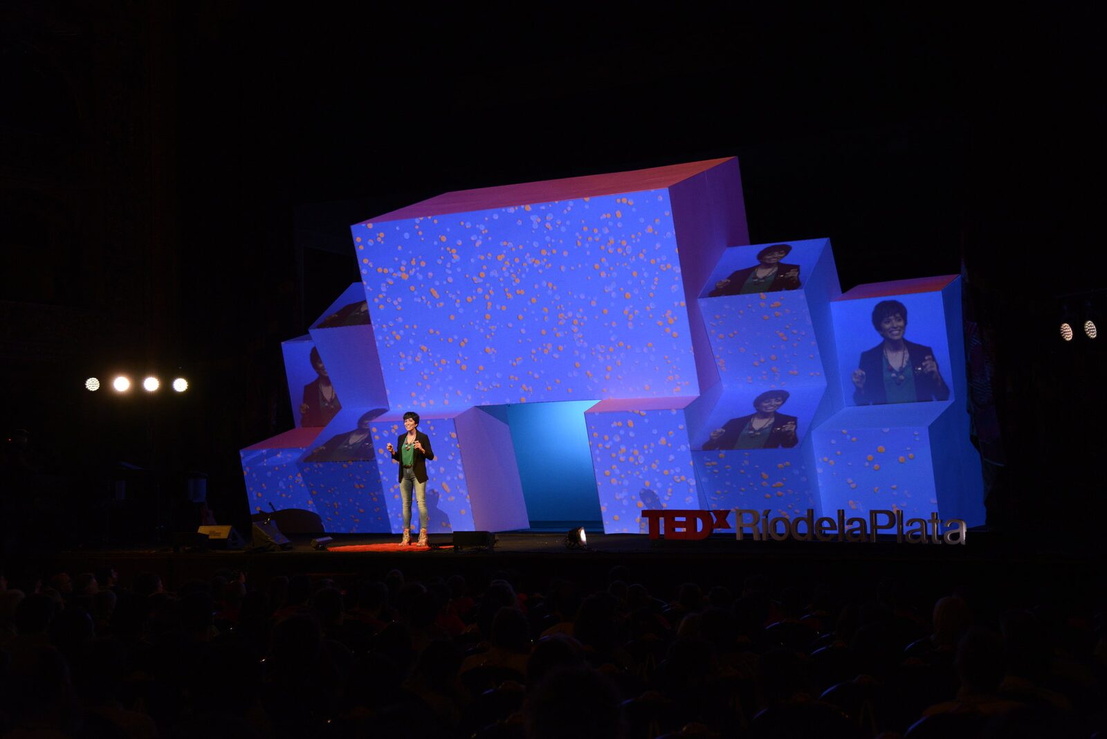 Yamila Miguel speaking on stage at TEDx Río de la Plata